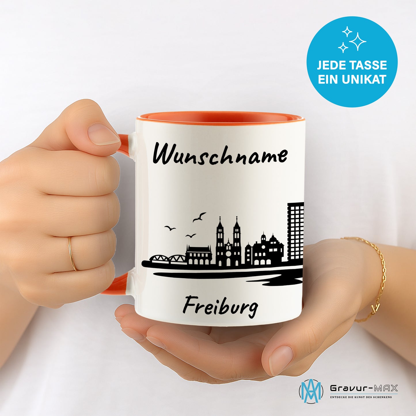 Tasse in Orange 330ml bedruckt mit der Skyline von Freiburg personalisierbar mit Wunschname
