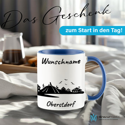 Tasse in Cambridge Blau 330ml bedruckt mit der Skyline von Oberstdorf personalisierbar mit Wunschname