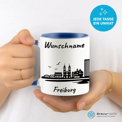 Tasse in Cambridge Blau 330ml bedruckt mit der Skyline von Freiburg personalisierbar mit Wunschname