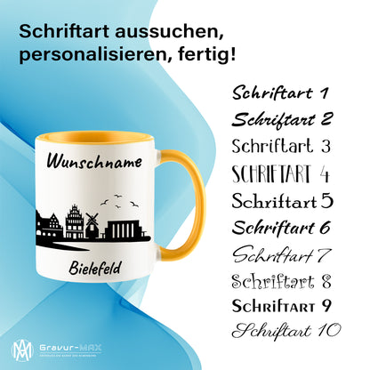 Tasse in Goldgelb 330ml bedruckt mit der Skyline von Bielefeld personalisierbar mit Wunschname