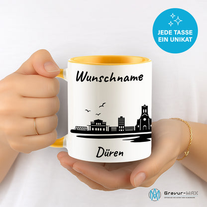 Tasse in Goldgelb 330ml bedruckt mit der Skyline von Düren personalisierbar mit Wunschname