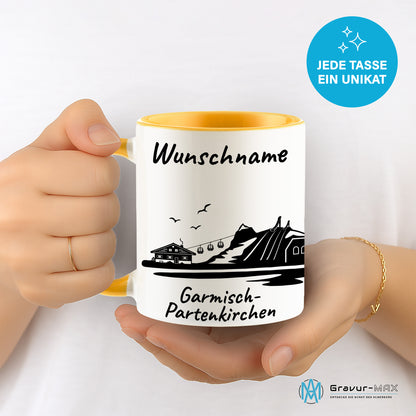 Tasse in Goldgelb 330ml bedruckt mit der Skyline von Garmisch-Partenkirchen personalisierbar mit Wunschname