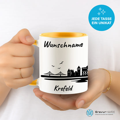 Tasse in Goldgelb 330ml bedruckt mit der Skyline von Krefeld personalisierbar mit Wunschname