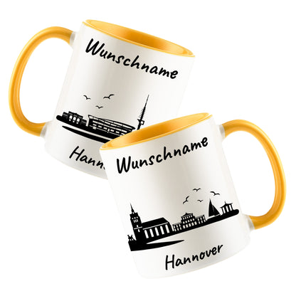 Tasse in Goldgelb 330ml bedruckt mit der Skyline von Hannover personalisierbar mit Wunschname
