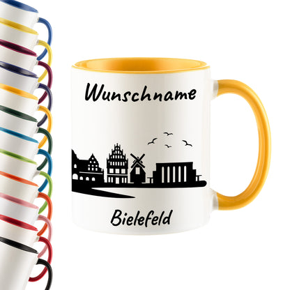 Tasse in Goldgelb 330ml bedruckt mit der Skyline von Bielefeld personalisierbar mit Wunschname