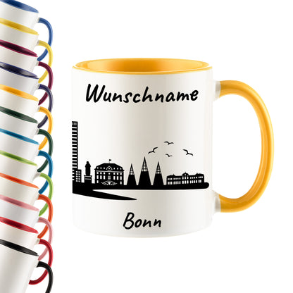 Tasse in Goldgelb 330ml bedruckt mit der Skyline von Bonn personalisierbar mit Wunschname
