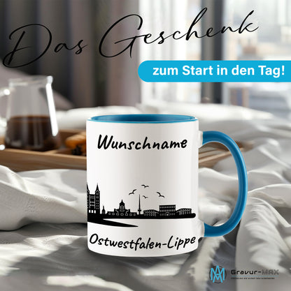 Tasse in Hellblau 330ml bedruckt mit der Skyline von Ostwestfalen-Lippe personalisierbar mit Wunschname