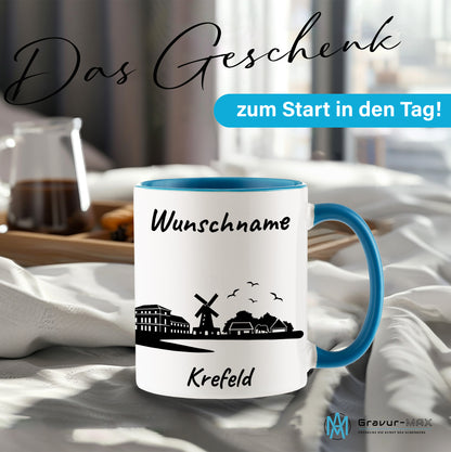 Tasse in Hellblau 330ml bedruckt mit der Skyline von Krefeld personalisierbar mit Wunschname