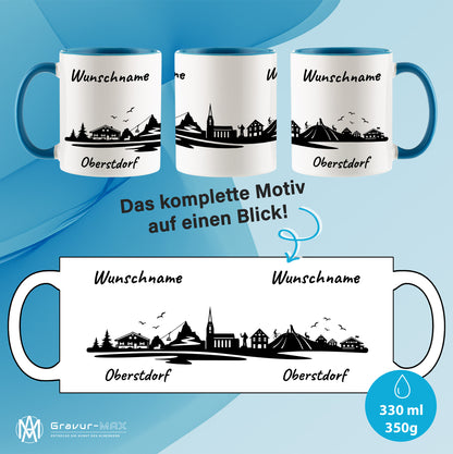 Tasse in Hellblau 330ml bedruckt mit der Skyline von Oberstdorf personalisierbar mit Wunschname