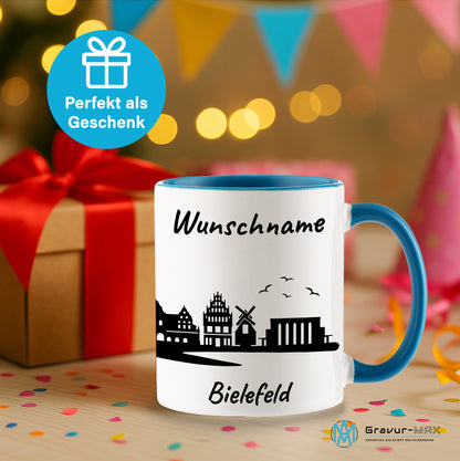Tasse in Hellblau 330ml bedruckt mit der Skyline von Bielefeld personalisierbar mit Wunschname
