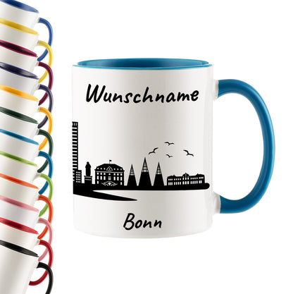 Tasse in Hellblau 330ml bedruckt mit der Skyline von Bonn personalisierbar mit Wunschname
