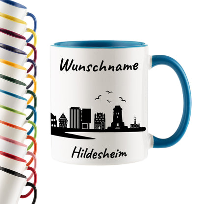 Tasse in Hellblau 330ml bedruckt mit der Skyline von Hildesheim personalisierbar mit Wunschname