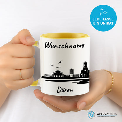 Tasse in Hellgelb 330ml bedruckt mit der Skyline von Düren personalisierbar mit Wunschname