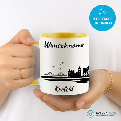 Tasse in Hellgelb 330ml bedruckt mit der Skyline von Krefeld personalisierbar mit Wunschname