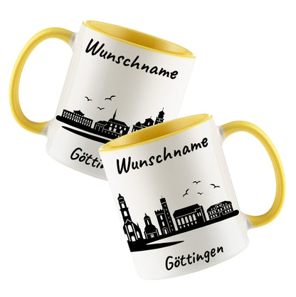 Tasse in Hellgelb 330ml bedruckt mit der Skyline von Göttingen personalisierbar mit Wunschname