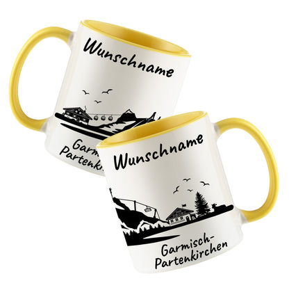 Tasse in Hellgelb 330ml bedruckt mit der Skyline von Garmisch-Partenkirchen personalisierbar mit Wunschname