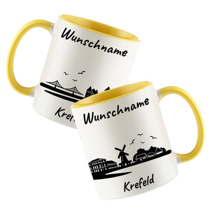 Tasse in Hellgelb 330ml bedruckt mit der Skyline von Krefeld personalisierbar mit Wunschname