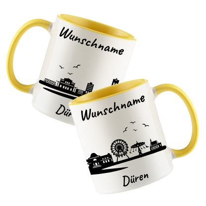 Tasse in Hellgelb 330ml bedruckt mit der Skyline von Düren personalisierbar mit Wunschname