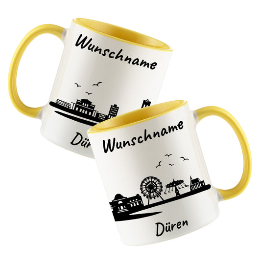 Tasse in Hellgelb 330ml bedruckt mit der Skyline von Düren personalisierbar mit Wunschname