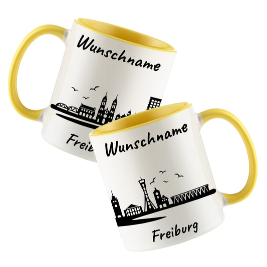Tasse in Hellgelb 330ml bedruckt mit der Skyline von Freiburg personalisierbar mit Wunschname