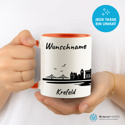 Tasse in Orange 330ml bedruckt mit der Skyline von Krefeld personalisierbar mit Wunschname