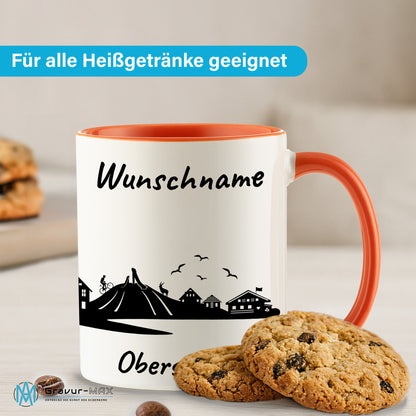 Tasse in Orange 330ml bedruckt mit der Skyline von Oberstdorf personalisierbar mit Wunschname