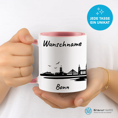 Tasse in Rosa 330ml bedruckt mit der Skyline von Bonn personalisierbar mit Wunschname