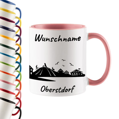 Tasse in Rosa 330ml bedruckt mit der Skyline von Oberstdorf personalisierbar mit Wunschname