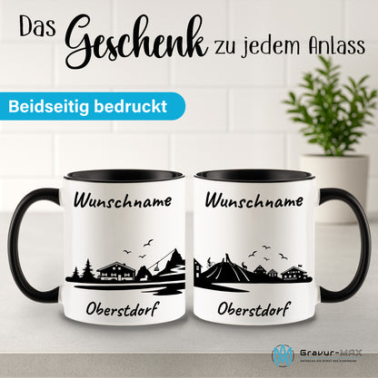 Tasse in Schwarz 330ml bedruckt mit der Skyline von Oberstdorf personalisierbar mit Wunschname