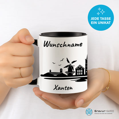 Tasse in Schwarz 330ml bedruckt mit der Skyline von Xanten personalisierbar mit Wunschname