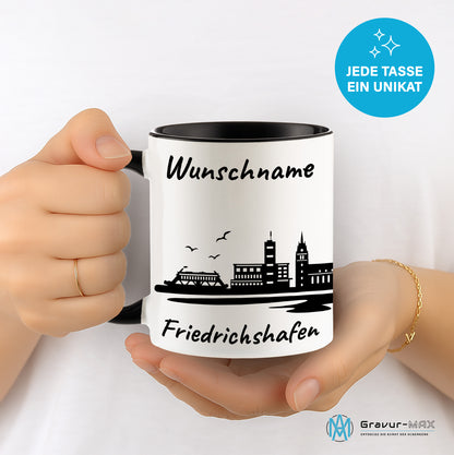 Tasse in Schwarz 330ml bedruckt mit der Skyline von Friedrichshafen personalisierbar mit Wunschname
