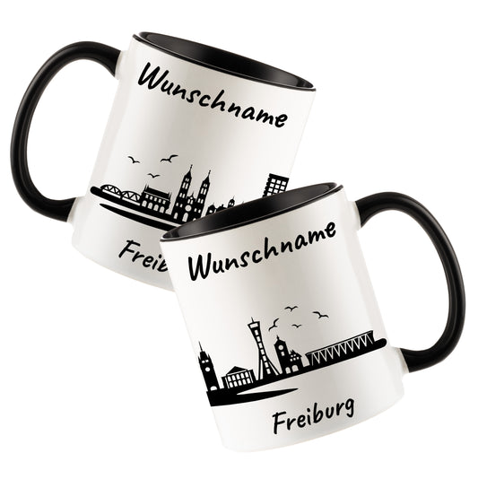 Tasse in Schwarz 330ml bedruckt mit der Skyline von Freiburg personalisierbar mit Wunschname