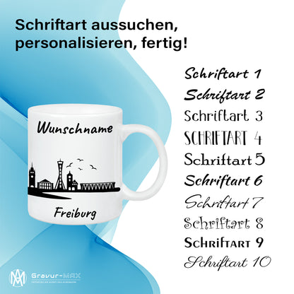 Tasse in Weiß 330ml bedruckt mit der Skyline von Freiburg personalisierbar mit Wunschname