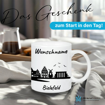 Tasse in Weiß 330ml bedruckt mit der Skyline von Bielefeld personalisierbar mit Wunschname