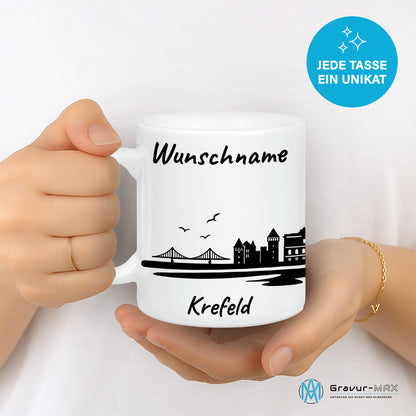 Tasse in Weiß 330ml bedruckt mit der Skyline von Krefeld personalisierbar mit Wunschname
