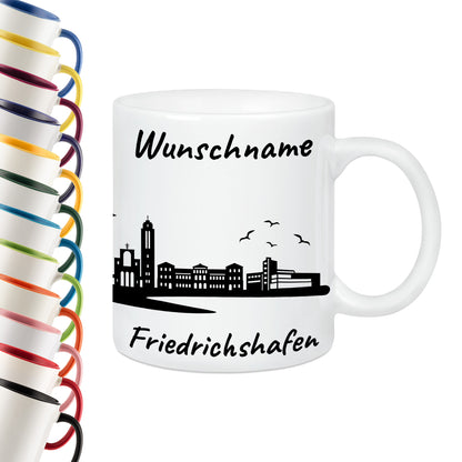 Tasse in Weiß 330ml bedruckt mit der Skyline von Friedrichshafen personalisierbar mit Wunschname